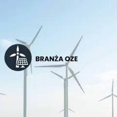 Wiatraki i panele słoneczne symbolizują branżę OZE. Dowiedz się, co to jest OZE i jak wpływa na przyszłość energetyki.